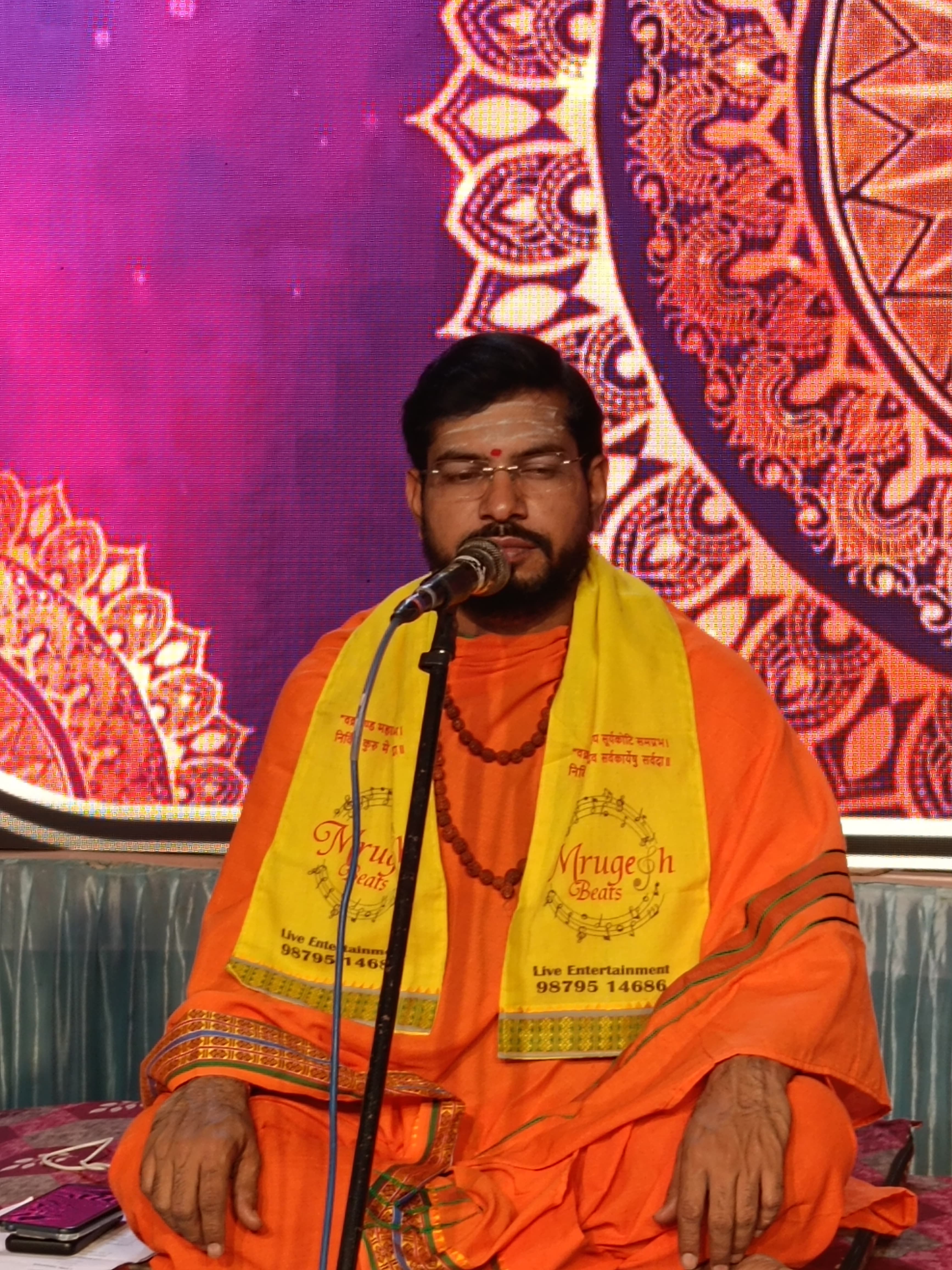 Flute player performing live on an outdoor stage